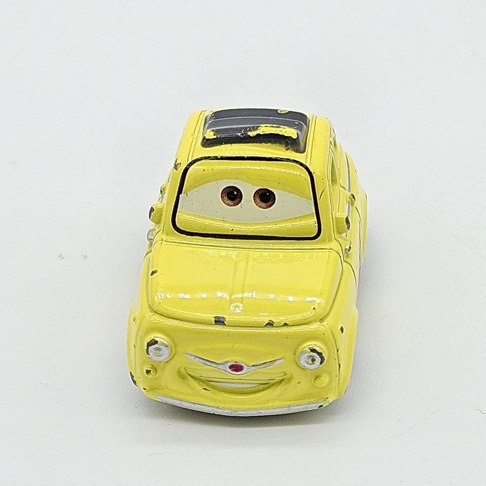 Disney Pixar Cars Luigi Yellow Diecast Car 95 Flame Side Toy Loose 2.5 Inch